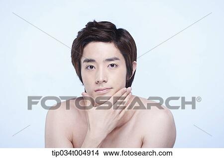 a topless man touching his chin View Large Photo Image Picture - a topless man touching his chin. Fotosearch