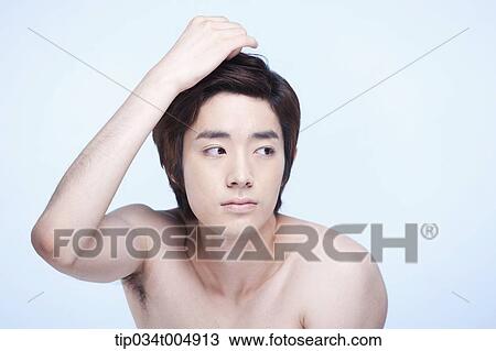 a topless man touching his chin View Large Photo Image Stock Image - a topless man touching his chin. Fotosearch