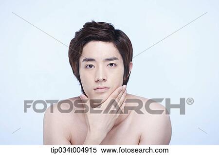 a topless man touching his chin View Large Photo Image Stock Photography - a topless man touching his chin. Fotosearch