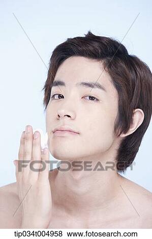 Stock Photo - a topless man with shaving cream on his fingers . Fotosearch