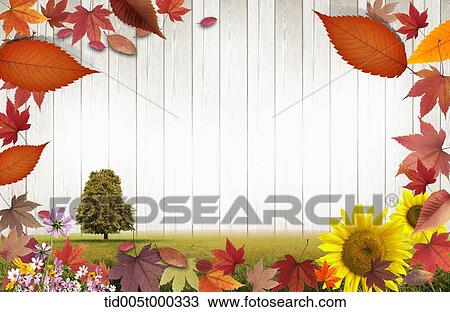 Stock Image - a tree in a field with wooden plank background surrounded by autumn leaves. Fotosearch