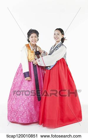Stock Image - a woman and her mother in Hanbok. Fotosearch