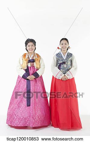 Stock Image - a woman and her mother in Hanbok. Fotosearch