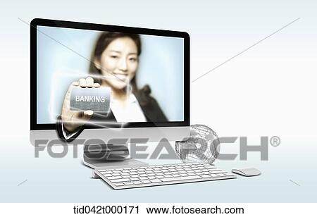 a woman holding a banking card inside a computer View Large Photo Image Stock Image - a woman holding a banking card inside a computer. Fotosearch