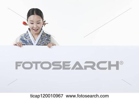 a woman in Hanbok holding an empty whiteboard View Large Photo Image Stock Photo - a woman in Hanbok holding an empty whiteboard. Fotosearch