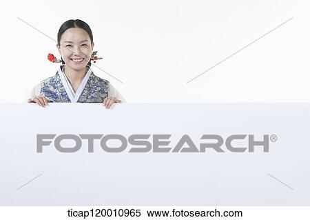 a woman in Hanbok holding an empty whiteboard View Large Photo Image Stock Photography - a woman in Hanbok holding an empty whiteboard. Fotosearch