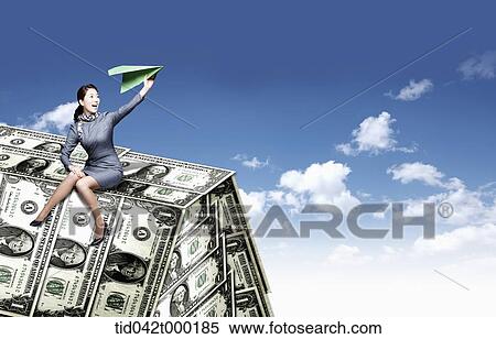 a woman sitting on dollar roof View Large Photo Image Stock Photography - a woman sitting on dollar roof . Fotosearch