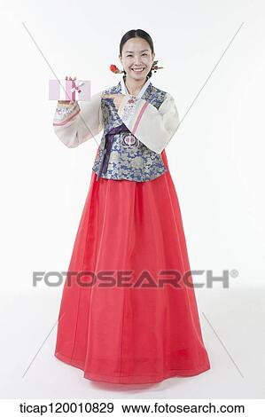 a woman wearing a Hanbok holding an envelope View Large Photo Image Stock Photo - a woman wearing a Hanbok holding an envelope . Fotosearch