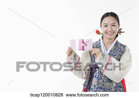 a woman wearing a Hanbok holding an envelope View Large Photo Image Stock Photograph - a woman wearing a Hanbok holding an envelope . Fotosearch