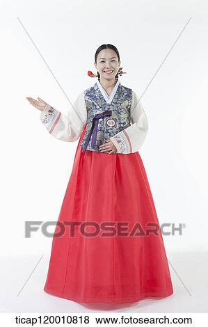 a woman wearing a Hanbok spreading one arm View Large Photo Image Stock Photo - a woman wearing a Hanbok spreading one arm. Fotosearch