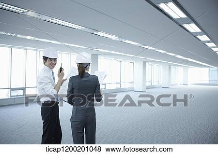 architect executives discussing in an empty room View Large Photo Image Stock Photo - architect executives discussing in an empty room . Fotosearch