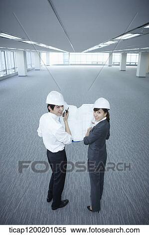 architect executives looking back in an empty room View Large Photo Image Stock Photography - architect executives looking back in an empty room . Fotosearch
