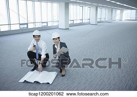 architect executives posing at camera in an empty room View Large Photo Image Stock Image - architect executives posing at camera in an empty room. Fotosearch