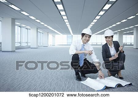 architect executives posing at camera in an empty room View Large Photo Image Stock Image - architect executives posing at camera in an empty room. Fotosearch