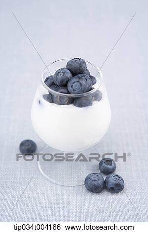 blueberries on a milkshake View Large Photo Image Stock Photograph - blueberries on a milkshake . Fotosearch