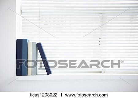 books standing on the window View Large Photo Image Stock Image - books standing on the window. Fotosearch