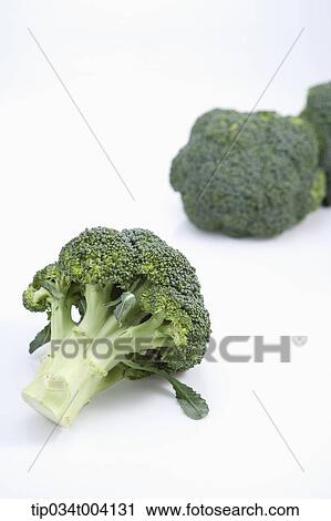 Stock Image - broccoli in white background . Fotosearch