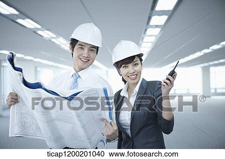 close up shot of architect executives in an empty room View Large Photo Image Stock Image - close up shot of architect executives in an empty room. Fotosearch