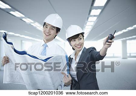 close up shot of architect executives in an empty room View Large Photo Image Stock Photograph - close up shot of architect executives in an empty room. Fotosearch