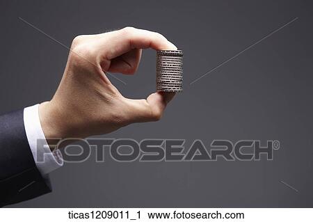 coin held by fingers View Large Photo Image Stock Image - coin held by fingers . Fotosearch