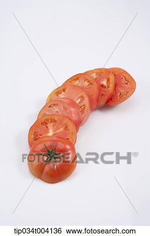 cut tomatoes in a line View Large Photo Image Stock Photograph - cut tomatoes in a line . Fotosearch