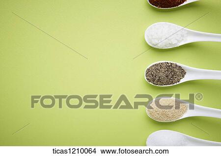different colours of sugar on Chinese spoons in a line View Large Photo Image Picture - different colours of sugar on Chinese spoons in a line. Fotosearch
