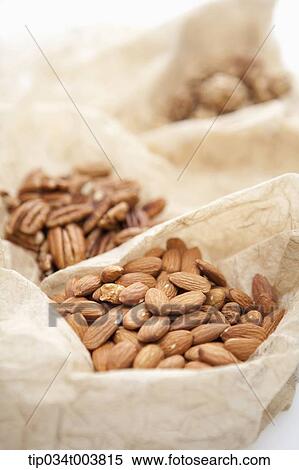 different sorts of nuts in different cloth bags View Large Photo Image Stock Photography - different sorts of nuts in different cloth bags . Fotosearch
