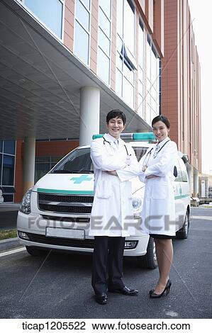 doctors standing in front of the ambulance with their arms folded View Large Photo Image Stock Image - doctors standing in front of the ambulance with their arms folded . Fotosearch