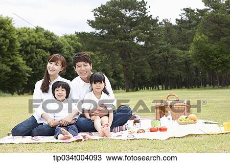Stock Image - family photo in a picnic . Fotosearch