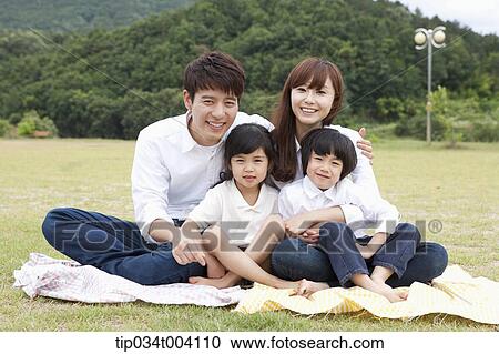 family wearing jeans posing at camera in picnic View Large Photo Image Stock Image - family wearing jeans posing at camera in picnic. Fotosearch
