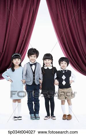 Stock Photo - four kids on a stage with arms in arms . Fotosearch