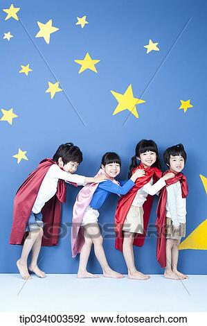 four kids wearing superman capes standing in a line leaning forward View Large Photo Image Stock Image - four kids wearing superman capes standing in a line leaning forward . Fotosearch