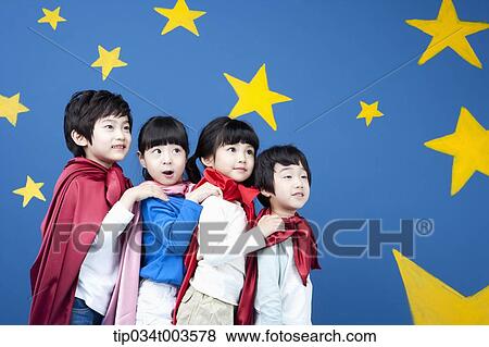 four kids wearing superman capes standing in a line in front of a blue wall full of stars View Large Photo Image Stock Photo - four kids wearing superman capes standing in a line in front of a blue wall full of stars. Fotosearch