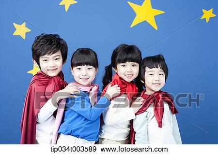 four kids wearing superman capes standing in a line holding one another's shoulders View Large Photo Image Stock Photo - four kids wearing superman capes standing in a line holding one another's shoulders. Fotosearch