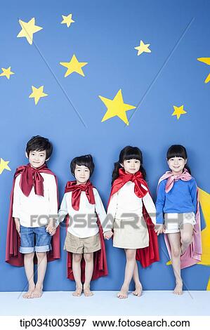four kids wearing superman capes standing in a line with their backs on a wall View Large Photo Image Stock Photo - four kids wearing superman capes standing in a line with their backs on a wall. Fotosearch