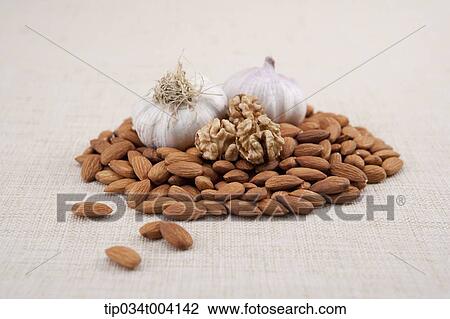 garlic bulbs and almonds View Large Photo Image Stock Image - garlic bulbs and almonds . Fotosearch