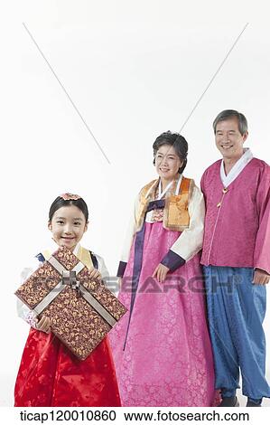 grandparents behind a girl holding present View Large Photo Image Stock Image - grandparents behind a girl holding present . Fotosearch