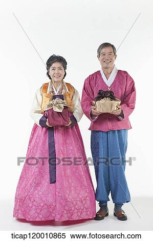grandparents holding packages in Hanbok View Large Photo Image Stock Photography - grandparents holding packages in Hanbok. Fotosearch