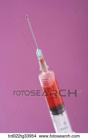injection needle filled up with red substance View Large Photo Image Picture - injection needle filled up with red substance . Fotosearch