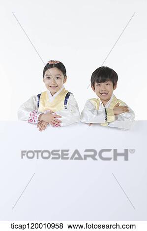 kids in Hanbok holding an empty whiteboard View Large Photo Image Stock Photo - kids in Hanbok holding an empty whiteboard. Fotosearch