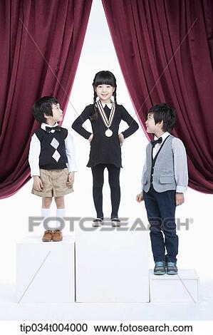 kids standing on podium with medals in front of red curtains View Large Photo Image Stock Image - kids standing on podium with medals in front of red curtains. Fotosearch