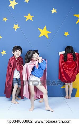 kids wearing superman capes playing hide and seek View Large Photo Image Stock Image - kids wearing superman capes playing hide and seek. Fotosearch