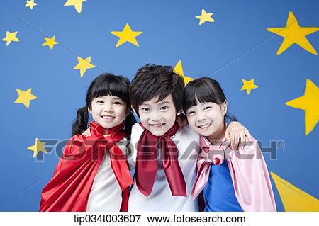 kids wearing superman capes smiling in front of a blue wall full of stars View Large Photo Image Stock Photo - kids wearing superman capes smiling in front of a blue wall full of stars. Fotosearch