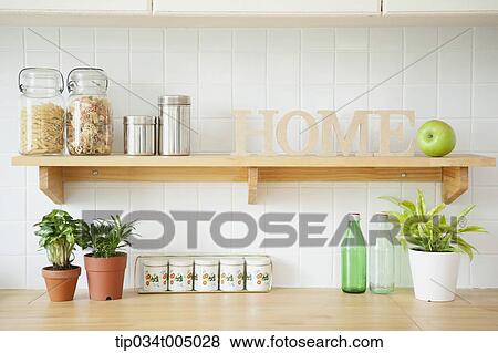 Stock Photo - kitchen shelves with home letters . Fotosearch