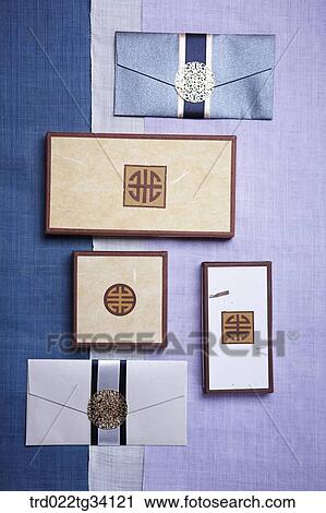 Stock Image - Korean boxes and envelopes on a traditional cloth. Fotosearch