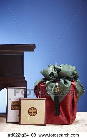 Stock Photo - Korean boxes on the floor with a package in Korean traditional wrap . Fotosearch
