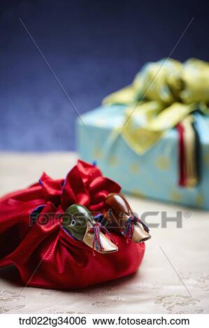 Korean traditional bag next to a package wrapped in traditional wrap View Large Photo Image Stock Photograph - Korean traditional bag next to a package wrapped in traditional wrap . Fotosearch