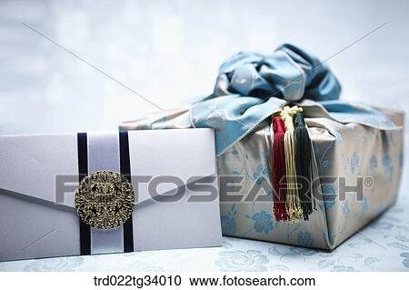 Stock Image - Korean traditional envelope and a package wrapped in a traditional wrap . Fotosearch