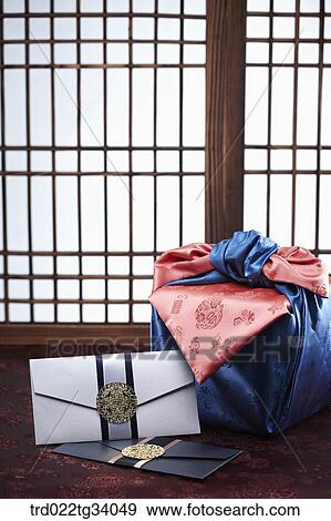 Stock Photo - Korean traditional envelope and a package in front of Korean traditional paper door. Fotosearch