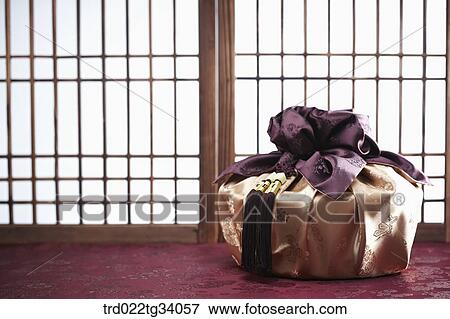 Stock Photo - Korean traditional package in front of Korean traditional paper door. Fotosearch